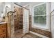 Shower stall with tiled walls and striped shower curtain at 7108 Roselake Cir, Douglasville, GA 30134