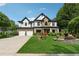 Stunning two-story home with a three-car garage and landscaped yard at 7108 Roselake Cir, Douglasville, GA 30134
