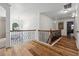 Spacious hallway featuring hardwood floors and an ornate railing at 7108 Roselake Cir, Douglasville, GA 30134
