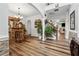 Elegant entryway with a built-in bar, hardwood floors and plant accents at 7108 Roselake Cir, Douglasville, GA 30134