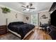 Large main bedroom with hardwood floors and ceiling fan at 7108 Roselake Cir, Douglasville, GA 30134