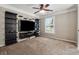 Spacious media room featuring built-in shelving and plush carpeting at 7108 Roselake Cir, Douglasville, GA 30134