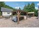 Outdoor patio area with stone flooring, multiple gazebos and grill at 7108 Roselake Cir, Douglasville, GA 30134