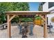 Stone patio with gazebo, outdoor kitchen, and seating area at 7108 Roselake Cir, Douglasville, GA 30134