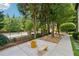Landscaped side yard with stone pathway and seating area at 7108 Roselake Cir, Douglasville, GA 30134