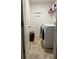 Convenient laundry room with washer, dryer, and storage shelves at 1797 Weatherbrook Cir, Lawrenceville, GA 30043