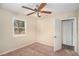 Bright bedroom with carpet, ceiling fan, and spacious closet at 3519 Adkins Nw Rd, Atlanta, GA 30331