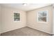 Bright bedroom featuring two windows and carpet flooring at 3519 Adkins Nw Rd, Atlanta, GA 30331