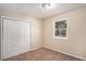 Bedroom with carpet, double door closet and natural light at 3519 Adkins Nw Rd, Atlanta, GA 30331
