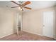 Well-lit bedroom with carpet flooring and ceiling fan at 3519 Adkins Nw Rd, Atlanta, GA 30331