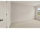 Bright bedroom with large window and carpet at 7174 Linden Dr, South Fulton, GA 30349