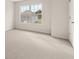 Spacious bedroom with neutral walls and carpeting at 7174 Linden Dr, South Fulton, GA 30349