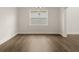 Elegant dining room with hardwood floors and large window at 7174 Linden Dr, South Fulton, GA 30349