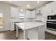 Modern kitchen with white cabinets, center island and stainless steel appliances at 7174 Linden Dr, South Fulton, GA 30349