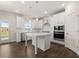Modern kitchen with white cabinets, center island and stainless steel appliances at 7174 Linden Dr, South Fulton, GA 30349