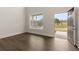 Bright living room with hardwood floors and access to the front porch at 7174 Linden Dr, South Fulton, GA 30349