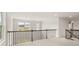 Open loft area with carpeted floor and railing at 7174 Linden Dr, South Fulton, GA 30349