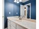 Updated bathroom with blue walls and a new vanity at 4140 Lansfaire Ter, Suwanee, GA 30024