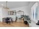 Small dining area with black table and two chairs, near entryway at 3576 Silvery Way, Powder Springs, GA 30127