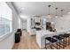 Modern kitchen with white cabinets, quartz countertops, and island with seating at 3576 Silvery Way, Powder Springs, GA 30127