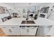 Modern kitchen island with white quartz countertops and stainless steel appliances at 3576 Silvery Way, Powder Springs, GA 30127