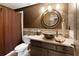 Dark brown bathroom with unique vessel sink and tile details at 420 Autry Mill Cir, Alpharetta, GA 30022