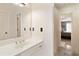 Simple bathroom with white vanity and striped wallpaper at 420 Autry Mill Cir, Alpharetta, GA 30022