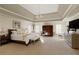 Large main bedroom with tray ceiling, fireplace and ample sunlight at 420 Autry Mill Cir, Alpharetta, GA 30022