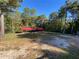 Outdoor dog kennels with red metal roof at 615 Woodruff Rd, Carrollton, GA 30116