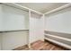 Large walk-in closet with double hanging rods and shelving at 668 Stokeswood Se Ave, Atlanta, GA 30316