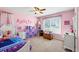 Charming bedroom with pink walls and Frozen bedding at 775 Holcombe Woods Ct, Auburn, GA 30011