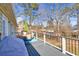 Deck with wooded view and outdoor furniture at 775 Holcombe Woods Ct, Auburn, GA 30011