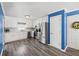 Kitchen with white cabinets, stainless steel appliances, and wood-look floors at 775 Holcombe Woods Ct, Auburn, GA 30011