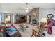 Living room with a stone fireplace, built-in shelving, and ample natural light at 775 Holcombe Woods Ct, Auburn, GA 30011