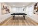 Finished basement game room, featuring a pool table and wood floors at 2750 Olde Towne Pkwy, Duluth, GA 30097