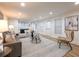 Open concept basement with seating area, large windows and pool table at 2750 Olde Towne Pkwy, Duluth, GA 30097