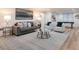 Relaxing basement living area with gray sofa and glass coffee table at 2750 Olde Towne Pkwy, Duluth, GA 30097