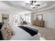 Spacious primary bedroom with tray ceiling, ample natural light, and walk-in closet at 2750 Olde Towne Pkwy, Duluth, GA 30097