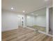 Bedroom with a large mirror wall and luxury vinyl plank flooring at 2750 Olde Towne Pkwy, Duluth, GA 30097