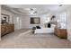 Primary bedroom with plush carpet, large bed, and ensuite bathroom access at 2750 Olde Towne Pkwy, Duluth, GA 30097