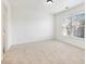 Well-lit bedroom featuring neutral walls and carpet at 2750 Olde Towne Pkwy, Duluth, GA 30097