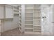 Spacious walk-in closet with shelving, hanging rods, and access to the bathroom at 2750 Olde Towne Pkwy, Duluth, GA 30097
