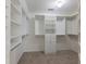 Large walk-in closet with custom built-in shelving and drawers at 2750 Olde Towne Pkwy, Duluth, GA 30097