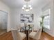 Bright dining room with hardwood floors and a glass-top table at 2750 Olde Towne Pkwy, Duluth, GA 30097