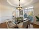 Formal dining room with hardwood floors, glass table and chandelier at 2750 Olde Towne Pkwy, Duluth, GA 30097