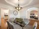 Formal dining room with hardwood floors, glass table and chandelier at 2750 Olde Towne Pkwy, Duluth, GA 30097