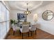 Formal dining room with hardwood floors, glass table and chandelier at 2750 Olde Towne Pkwy, Duluth, GA 30097