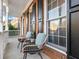 Inviting front porch with two wicker chairs and plants at 2750 Olde Towne Pkwy, Duluth, GA 30097
