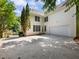 House's rear elevation featuring a two-car garage and backyard at 2750 Olde Towne Pkwy, Duluth, GA 30097