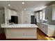 Bright, eat-in kitchen boasts white cabinets, sleek countertops, and stainless steel appliances at 2750 Olde Towne Pkwy, Duluth, GA 30097
